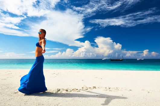 Woman in skirt at tropical beach