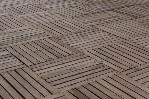 Patterns and textures of a wooden planks pavement