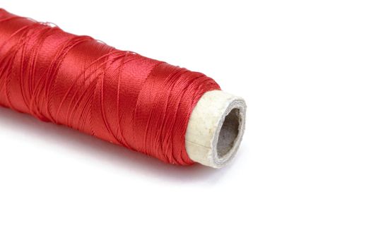 Spool of thread on white background