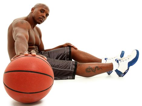 Attractive black 30s man with basket ball. Clipping path.