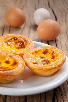 delicious portuguese egg tart on wood background