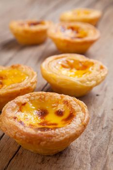 delicious portuguese egg tart on wood background