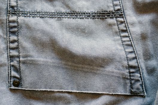 ligth bright jeans trousers pocket piece material texture closeup background.