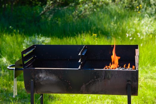 A charcoal grill in flames