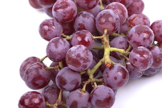 Cluster of red grapes isolated on a white background