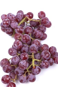 Cluster of red grapes isolated on a white background