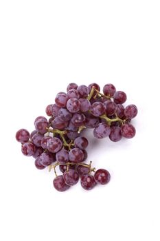 Cluster of red grapes isolated on a white background