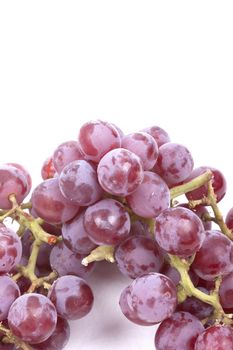 Cluster of red grapes isolated on a white background