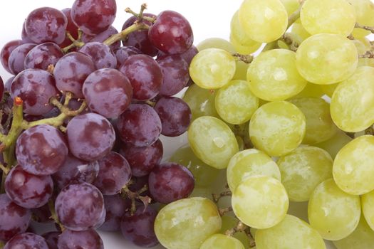 A bunch of green and red grapes isolated on a white background