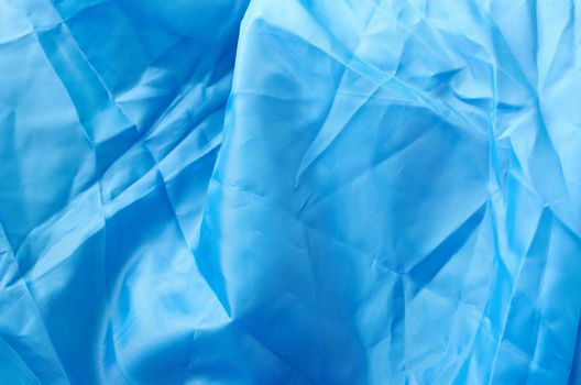 Crumpled blue fabric as natural background