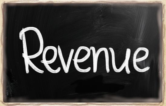"Revenue" handwritten with white chalk on a blackboard.