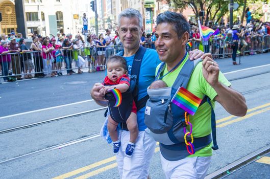 SAN FRANCISCO -  JUNE 30 : An unidentified Gay couple participates at the annual San Francisco Gay pride parade on June 30 2013