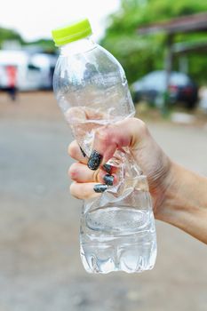 Woman squeeze bottle with anger