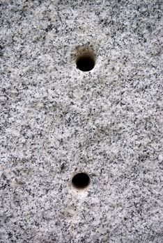 Round hole on the granite.The surface of Black and white granite stone. For texture background
