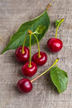 fresh cherries on wooden table