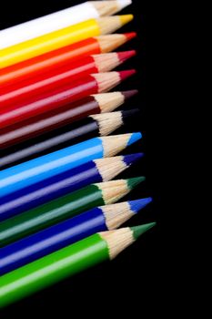 Color pencils isolated on black background