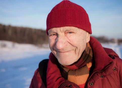 Old man outdoors. Winter time.