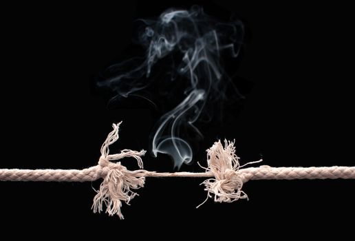 Burning rope on the verge of breaking into two