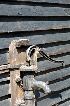 Vintage Water tap with wood background