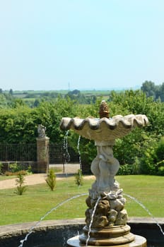 Fountain in classical  english garden