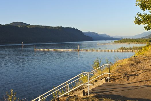 Columbia River Gorge river banks at sunset.