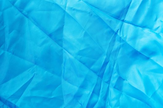 Crumpled blue fabric as natural background