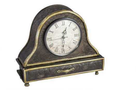 An old rustic desk clock that is isloated on a white background.