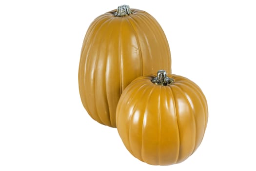 Two isolated pumpkins sitting side by side on a white background.