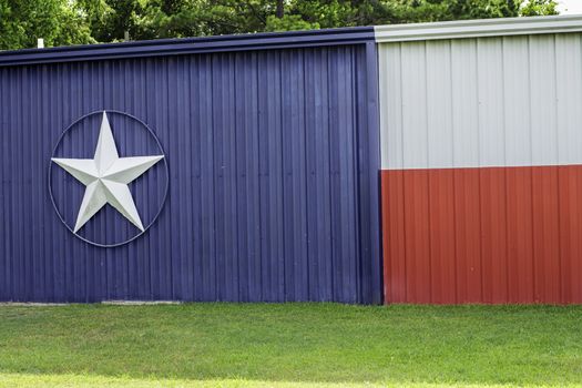 The Texas flag painted on the side of a building.