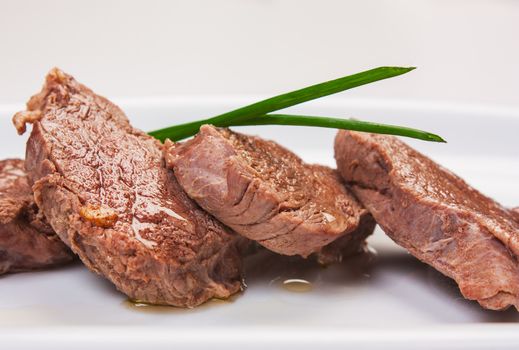 Juicy slices of roast beef on a plate