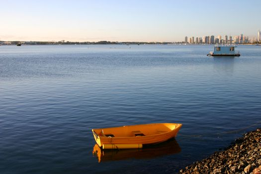 Early morning sun on a yellow dinghy.