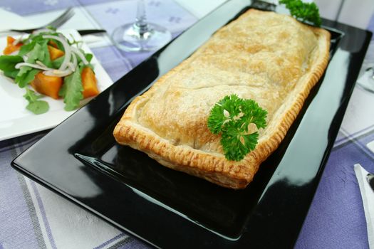 Mushroom and leek strudel with pumpkin and rocket salad.