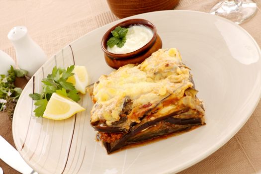 Delicious Greek moussaka with aubergine and a side garden salad.