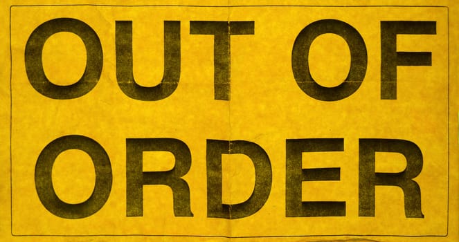 Grungy Yellow Paper Out Of Order Sign