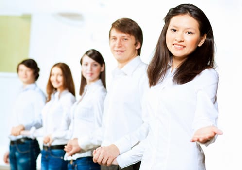 Image of five students in casual wear standing in row