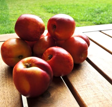 fresh peaches on wooden table

