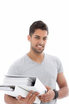 Handsome young man holding a pile of folders against the white background