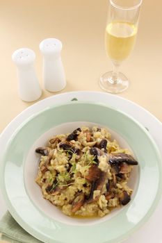 Delicious mushroom risotto served with fresh thyme.