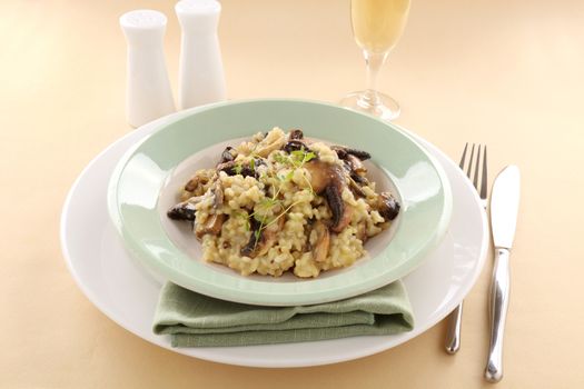 Delicious mushroom risotto served with fresh thyme.
