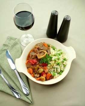 Slow roasted osso bucco with a green pea rice ready to serve.