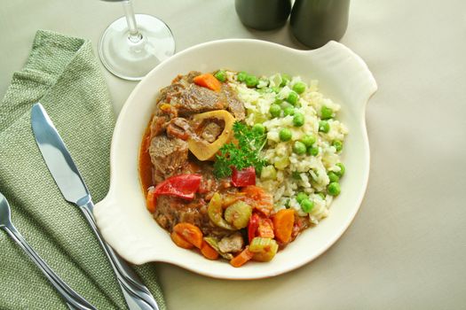 Slow roasted osso bucco with a green pea rice ready to serve.