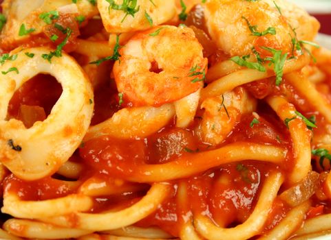Delicious spaghetti marinara with fish, shrimps, calamari and mussels with a spicy tomato sauce.
