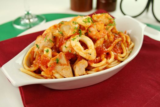 Delicious spaghetti marinara with fish, shrimps, calamari and mussels with a spicy tomato sauce.