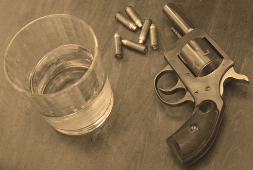 bullets, booze and a gun for a deadly combination in sepia