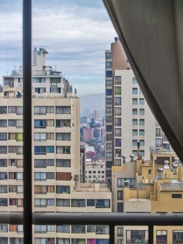 Santiago, June 2013. View of buildings in Santiago de Chile through a window