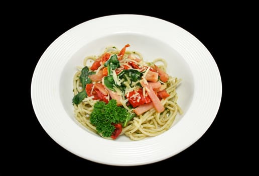 Spaghetti with bacon, pesto, sundried tomato and baby spinach topped with parmesan cheese.