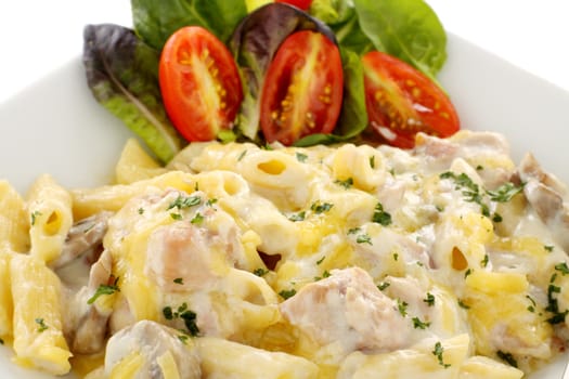 Delicious creamy chicken penne pasta with a garden salad.