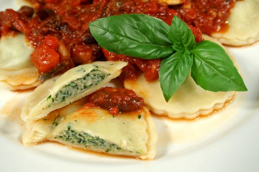 Delightful chicken and spinach ravioli with capsicum, olive and tomato sauce.