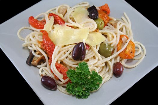 Delicious mediterranean style pasta with olives and sundried tomatoes,