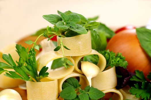 Selection of fresh ingredients required to make tomato based pasta dishes.